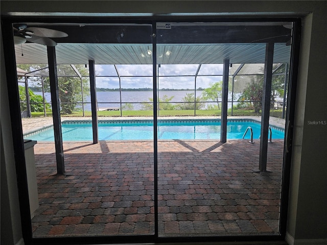 view of pool featuring a lanai, a patio area, and ceiling fan