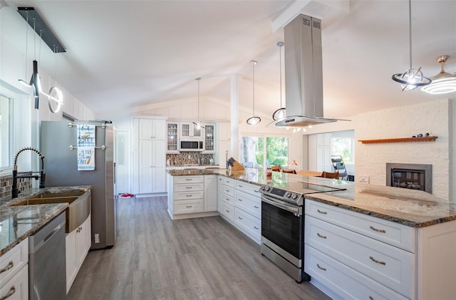 kitchen featuring white cabinets, appliances with stainless steel finishes, and island range hood