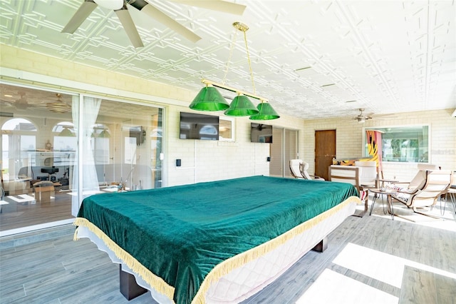 recreation room featuring tile walls, pool table, ceiling fan, and hardwood / wood-style flooring