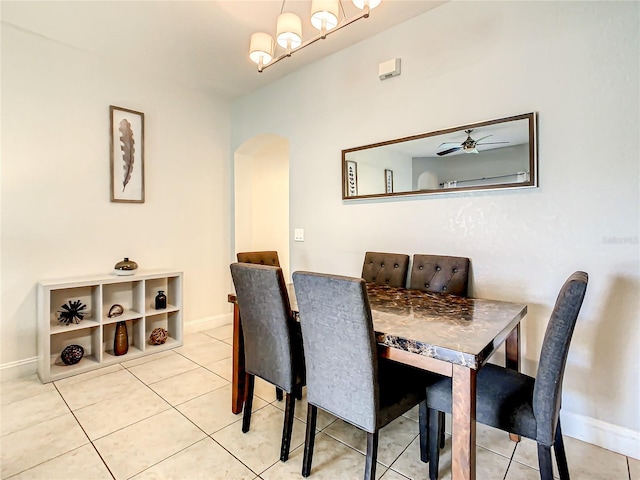 tiled dining space with ceiling fan