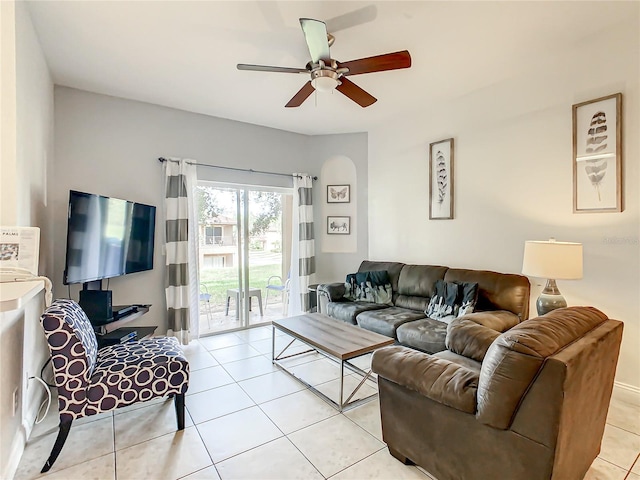 living room featuring ceiling fan and light tile flooring