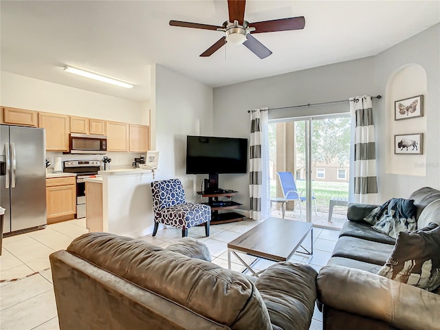 tiled living room with ceiling fan