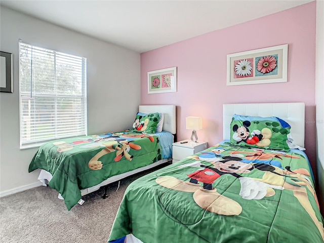 bedroom featuring light carpet