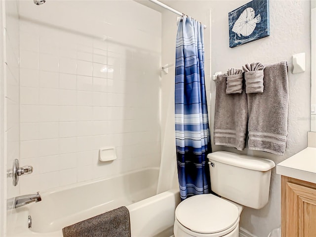 full bathroom featuring toilet, vanity, and shower / tub combo with curtain