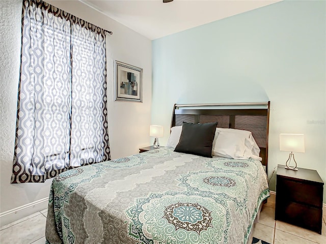 bedroom with light tile flooring