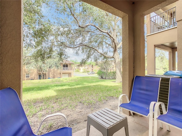 view of patio featuring a balcony