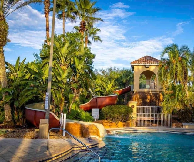 view of pool featuring a water slide