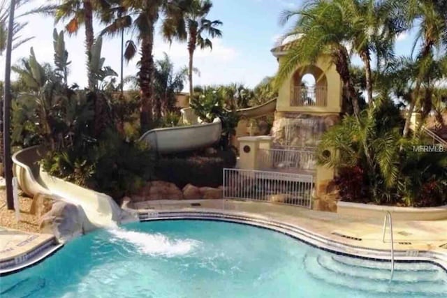 view of pool with a water slide