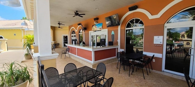 view of terrace featuring ceiling fan