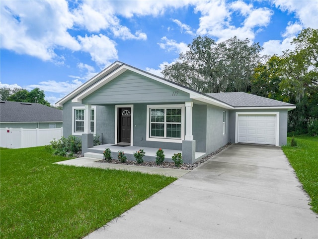 ranch-style home with a front yard and a garage