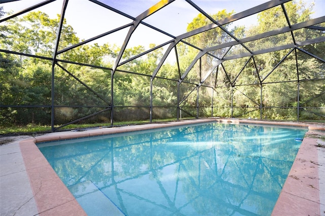 view of pool with a lanai