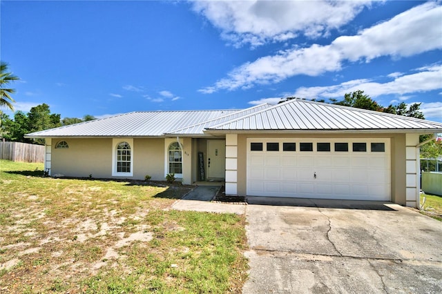 ranch-style house with a front yard and a garage