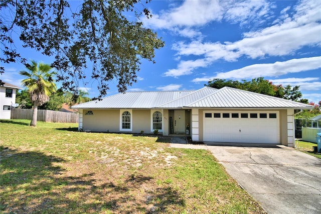 ranch-style home with a front lawn and a garage