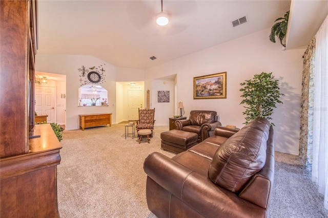 carpeted living room featuring vaulted ceiling