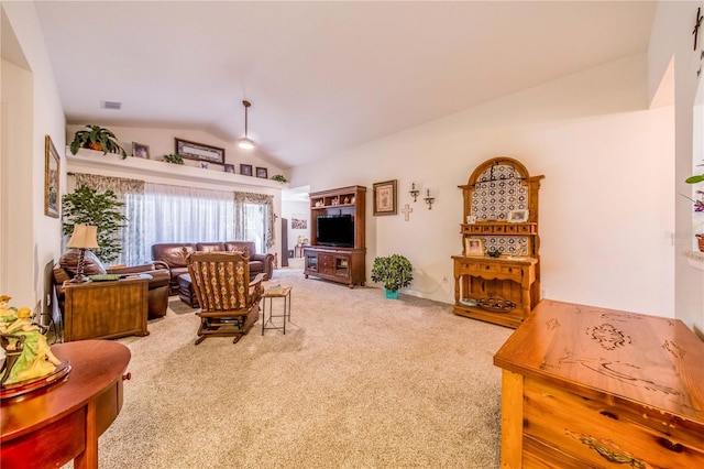 carpeted living room with lofted ceiling