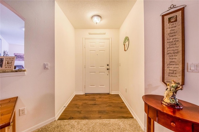 doorway to outside featuring light carpet