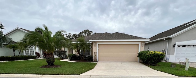 ranch-style home featuring a garage and a front lawn