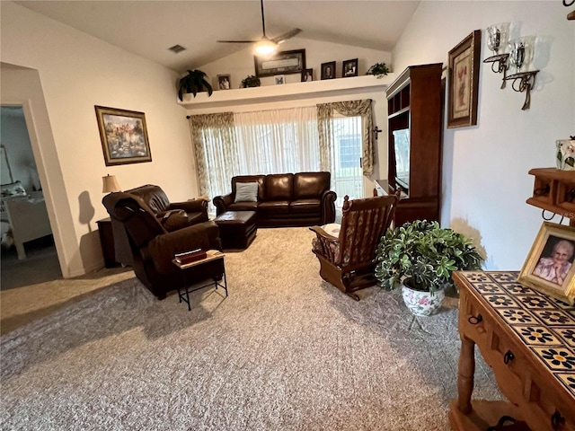 carpeted living room featuring ceiling fan and lofted ceiling