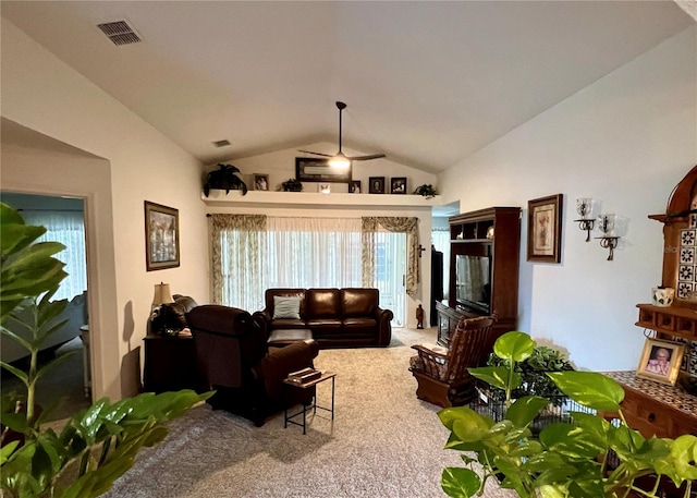 living room featuring lofted ceiling and carpet