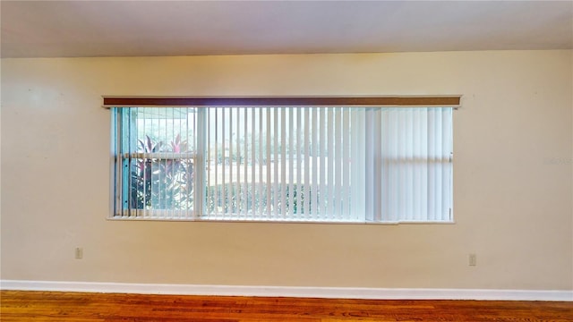 spare room featuring hardwood / wood-style flooring