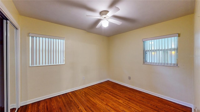 spare room featuring ceiling fan and wood-type flooring