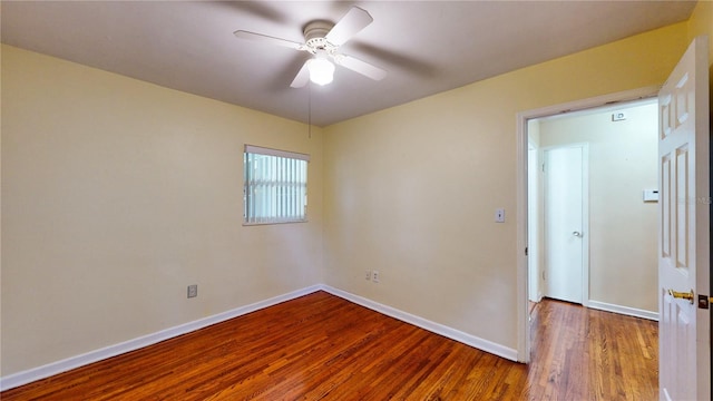 unfurnished room featuring ceiling fan and hardwood / wood-style flooring