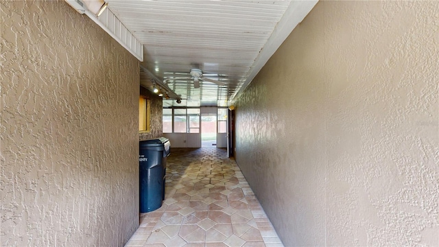 hallway with tile patterned flooring