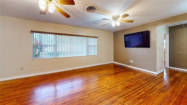 unfurnished room featuring hardwood / wood-style floors and ceiling fan