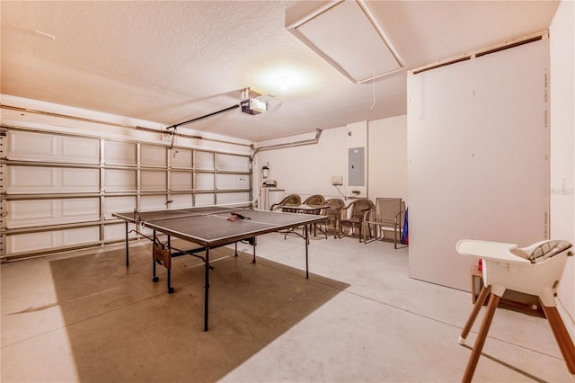 game room with electric panel and a textured ceiling