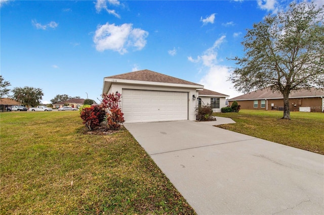 ranch-style home with a garage and a front yard