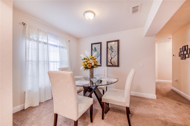 view of carpeted dining space