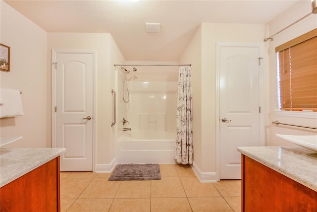 full bathroom with tile patterned flooring, shower / bath combination with curtain, vanity, and baseboards
