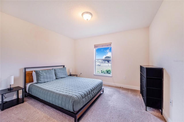 carpeted bedroom with baseboards