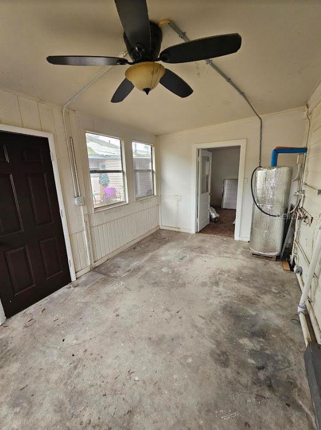 1414 Johns Ave, Haines City, FL 33844 - unfurnished bedroom featuring concrete flooring and ceiling fan
