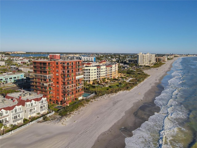 bird's eye view featuring a water view and a view of the beach