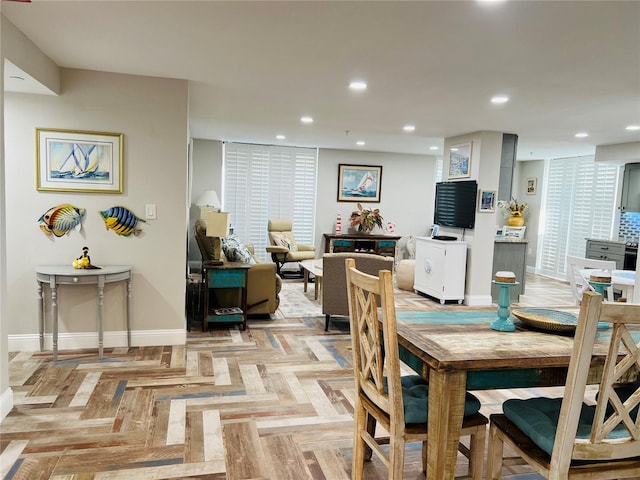 dining space with light parquet floors