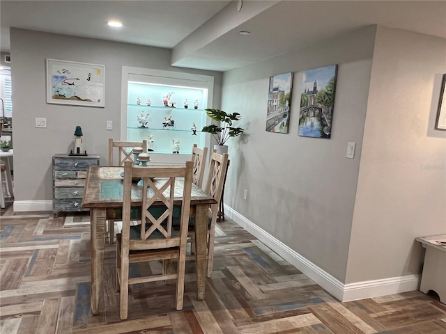 dining room with dark parquet floors