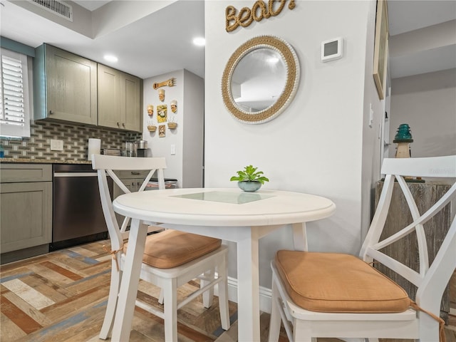 kitchen with dishwasher and backsplash