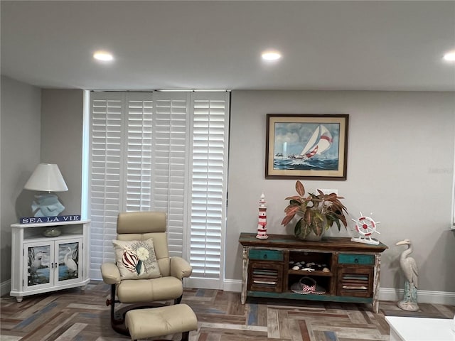 living area with dark parquet floors