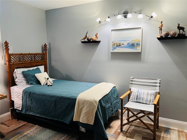 bedroom featuring wood-type flooring