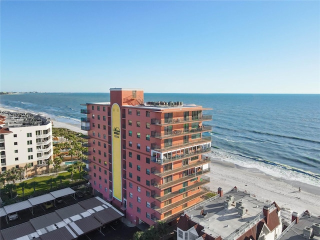 aerial view featuring a water view and a view of the beach