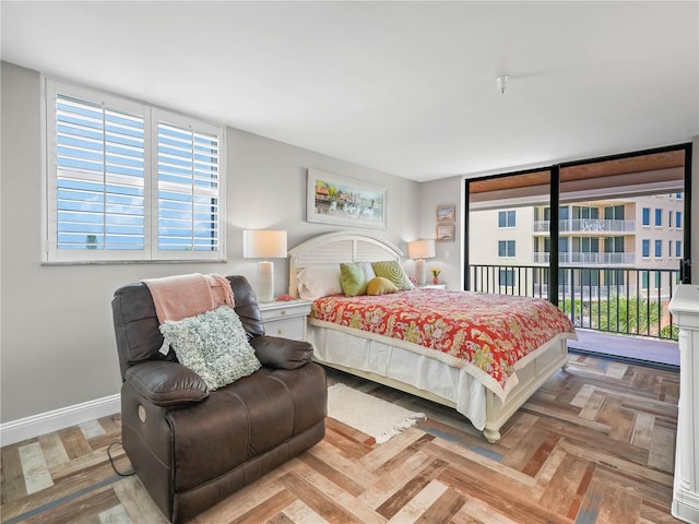 bedroom with access to exterior and parquet floors