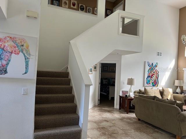 stairs with tile patterned floors