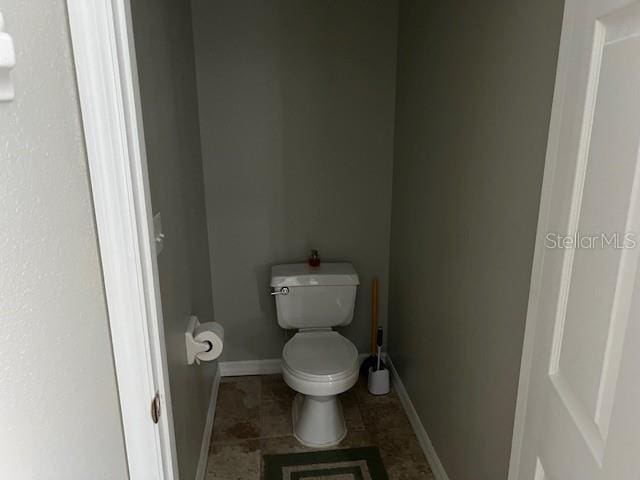 bathroom with tile patterned flooring and toilet