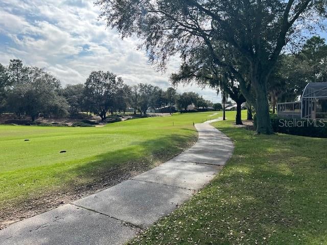 view of home's community with a lawn