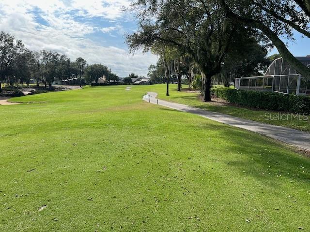 view of property's community featuring a yard