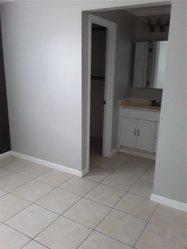 bathroom with vanity and tile patterned flooring