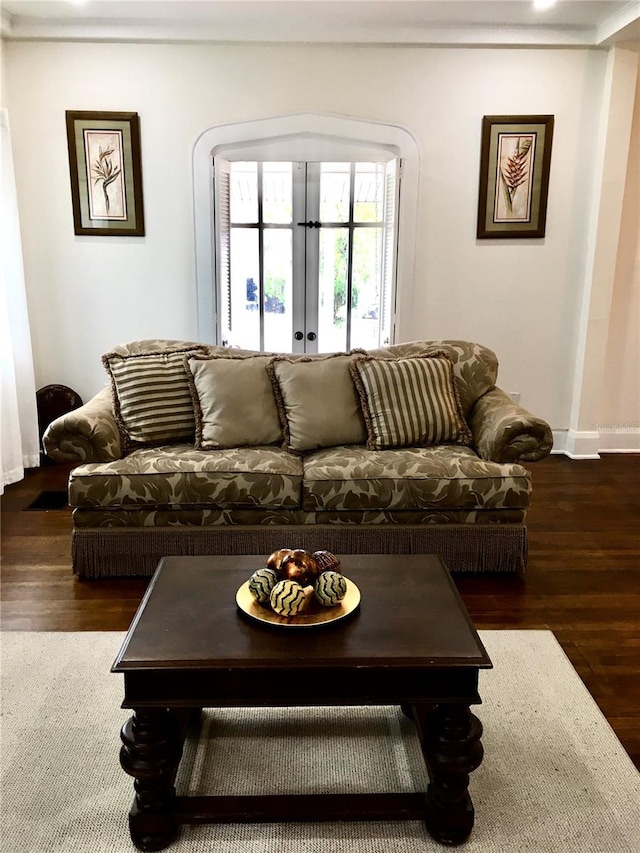 living room featuring french doors and dark hardwood / wood-style floors