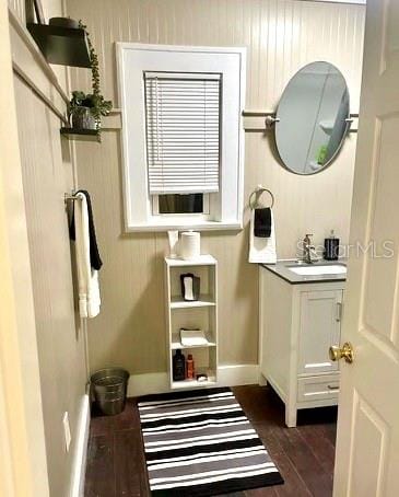 bathroom with vanity and hardwood / wood-style floors