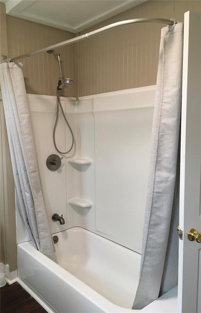 bathroom featuring hardwood / wood-style floors and shower / bath combo